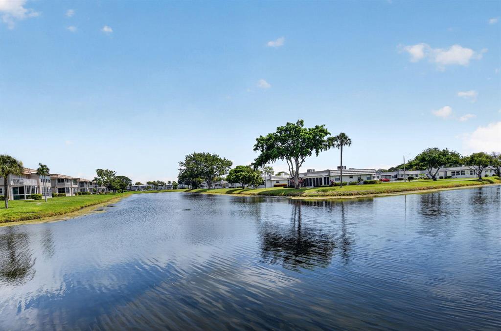 Lakeside grounds at Kings Point, Delray Beach — the community at 212 Monaco E